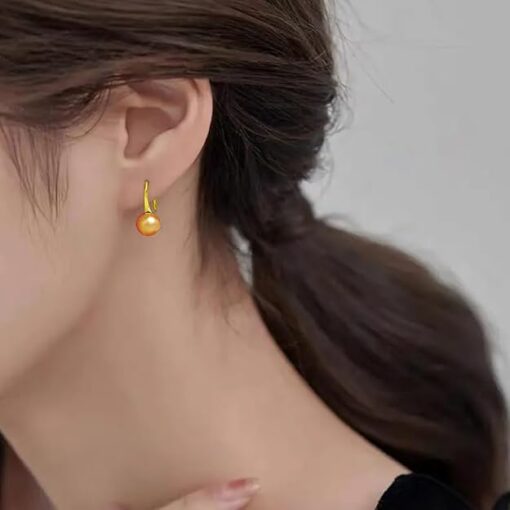 model wearing -gold finish SIVYAA Fresh Water Gold Pearl Tiny Drop Dangle pure silver Earrings