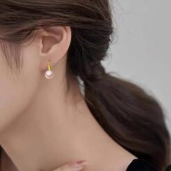 model wearing -gold finish SIVYAA Fresh Water Pink Pearl Tiny Drop Dangle pure silver Earrings