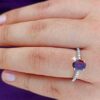 model wearing 1- SIVYAA Oval Cut Garnet & Cubic Zircon pure silver Finger Band