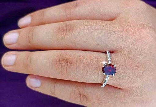 model wearing 1- SIVYAA Oval Cut Garnet & Cubic Zircon pure silver Finger Band