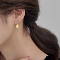model wearing - SIVYAA Fresh Water Gold Pearl Tiny Drop Dangle pure silver Earrings