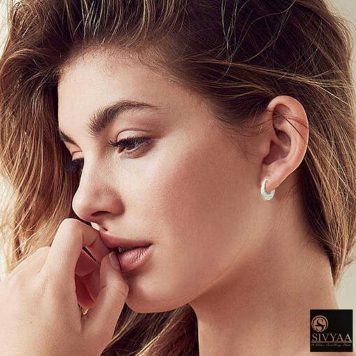 SIVYAA Kaju Shape flower textured Bali Hoops female model wearing