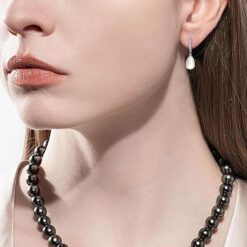 model wearing- SIVYAA Solitaire Fresh Water Tear Drop Pink Pearl Dangle pure silver Hoop Earrings