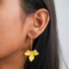 model wearing- SIVYAA handcrafted Gold Plated Tri-Petaled Flower pure silver dangle Earrings