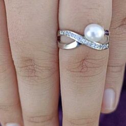 model wearing -SIVYAA White Fresh Water Pearl & Cubic Zirconia pure silver Criss-Cross Finger Ring
