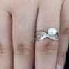 1model wearing -SIVYAA White Fresh Water Pearl & Cubic Zirconia pure silver Criss-Cross Finger Ring