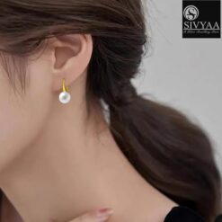 model wearing-SIVYAA gold finish Classic White Pearl Tiny Drop Dangle Earrings