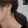 model wearing-SIVYAA Classic White Pearl Tiny Drop Dangle Earrings