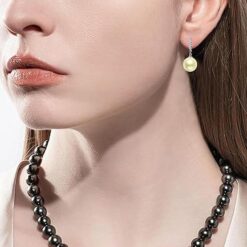 model wearing- SIVYAA Solitaire Classic Gold Pearl Drop Dangle Hoop Earrings