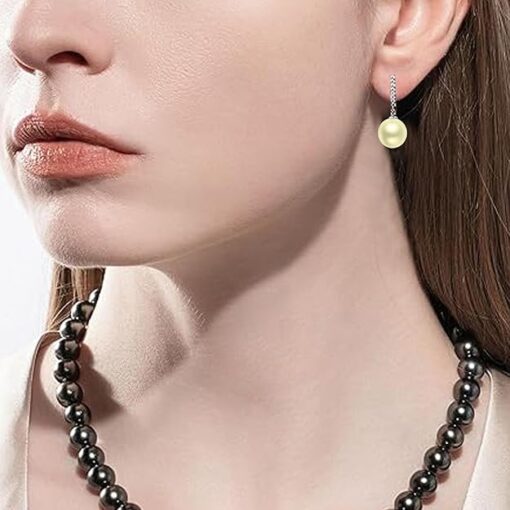 model wearing- SIVYAA Solitaire Classic Gold Pearl Drop Dangle Hoop Earrings