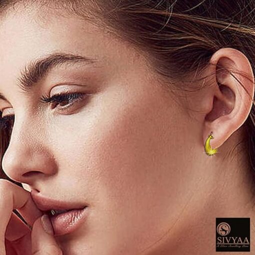 SIVYAA gold Kaju Shape grid textured Bali Hoops female model wearing
