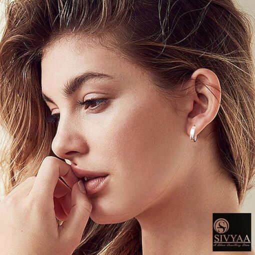 female model wearing- plain round flattish edge 15mm pure silver hoop bali earring'