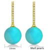 gold finish SIVYAA Solitaire Classic Turquoise Pearl Drop Dangle Hoop Earrings Detail