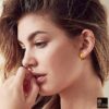 model wearing- gold finish round grid textured curvish edge bali 15mm