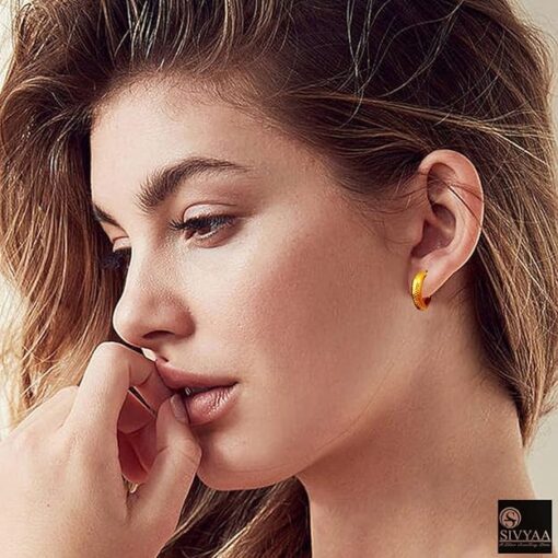 model wearing- gold finish round grid textured curvish edge bali 15mm