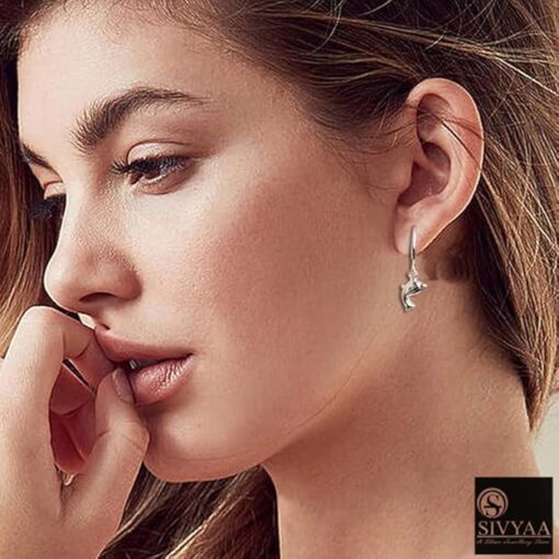 SIVYAA model wearing- dolphin charm silver hoop