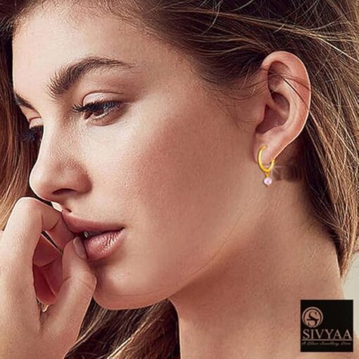 SIVYAA-model wearing- drop pink pearl charm gold polish silver hoop