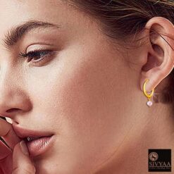 SIVYAA-model wearing- drop pink pearl charm gold finish silver hoop bali