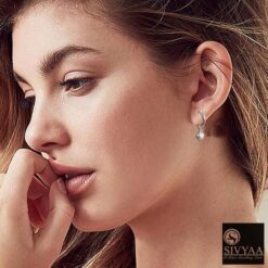 SIVYAA model wearing-heart charm silver hoop bali