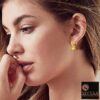 SIVYAA -model wearing- heart charm drop Textured Round Gold finish Silver hoop