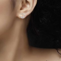 model wearing SIVYAA Silver Moon n Star Round CZ Stud Earring