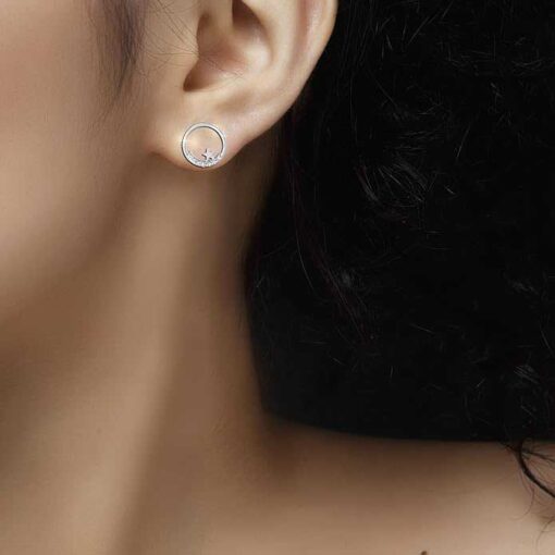 model wearing SIVYAA Silver Moon n Star Round CZ Stud Earring