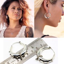 model wearing-Oxidized 925 silver tribal hoop earrings with dotted accents and crescent design