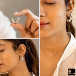 model wearing 3-925 sterling silver oxidized crescent tribal hoop earrings with filigree central design