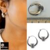 model wearing-23mm width 925 sterling silver oxidized crescent tribal hoop earrings with filigree central design